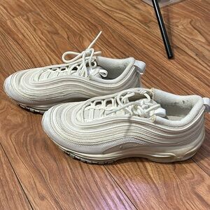 Nike white sneakers has reflectors